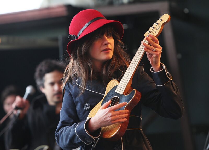 Woman playing ukulele on stage