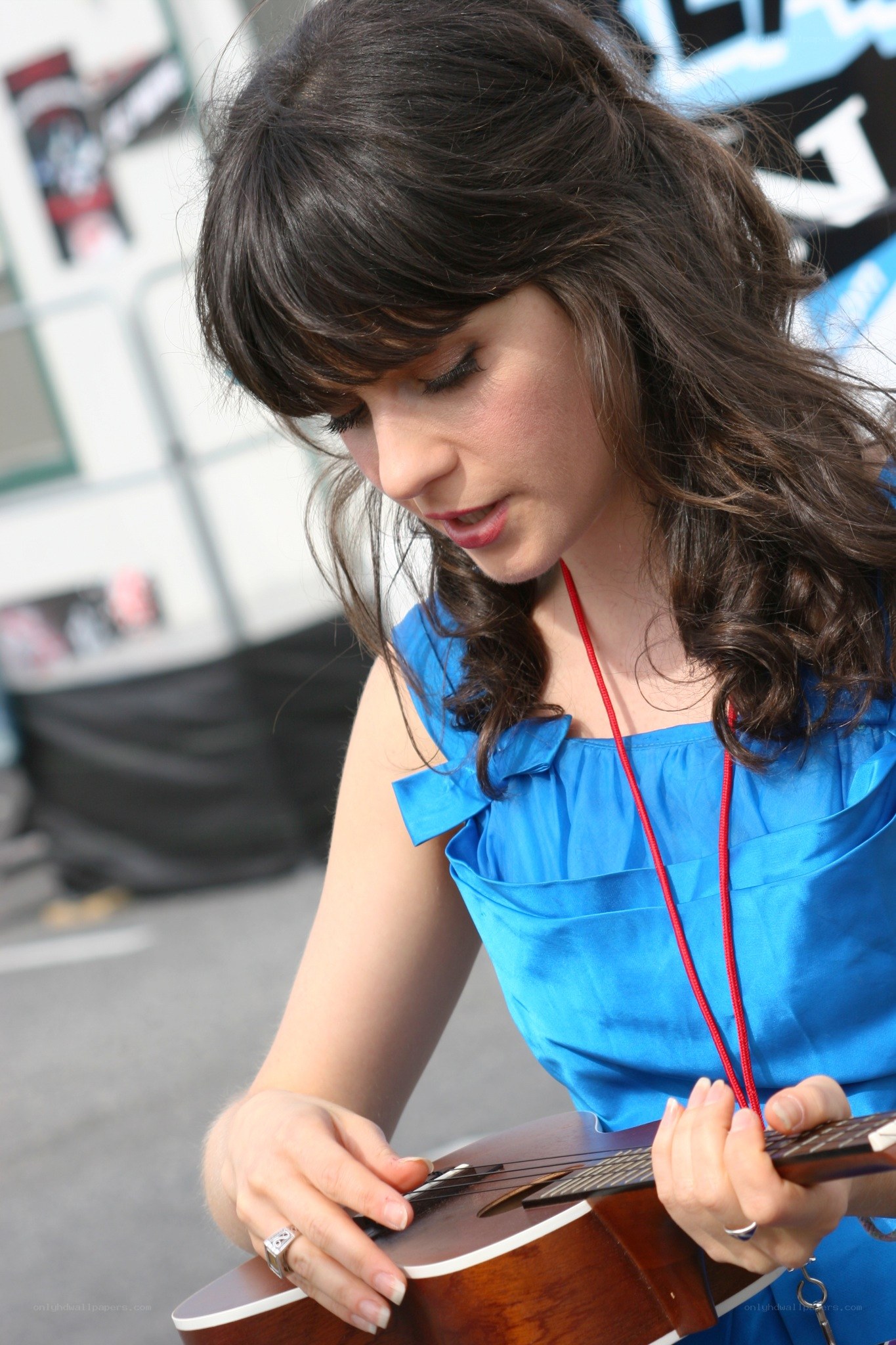 woman playing ukulele