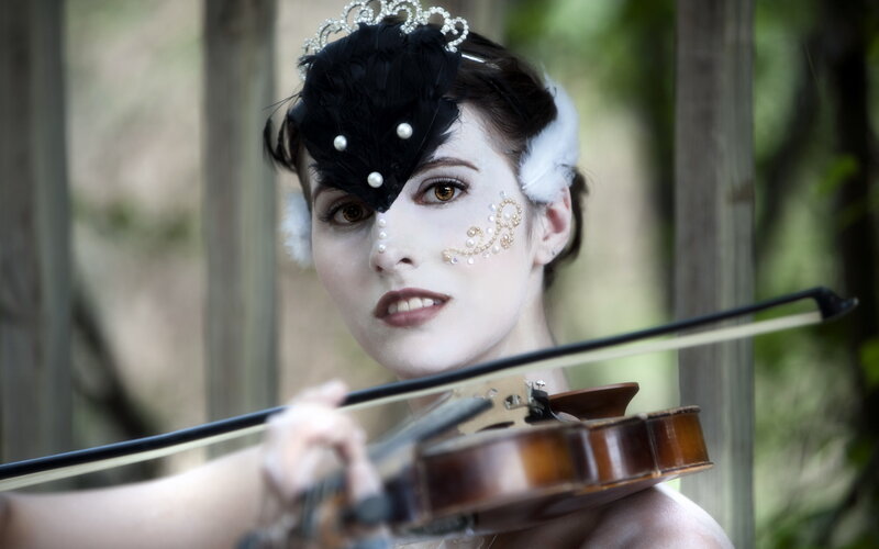Woman Playing Violin — Black, Dramatic, Photograph, Feather Hat