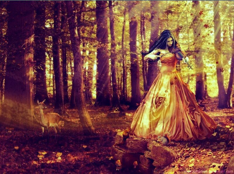 Woman playing violin in autumn forest