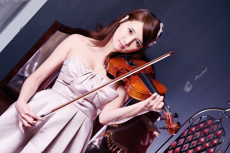 woman playing violin in dress