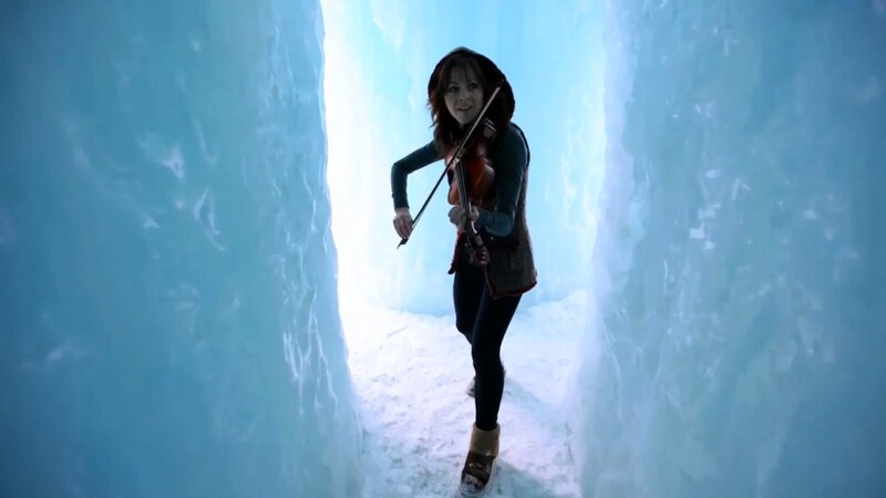 woman playing violin in ice tunnel