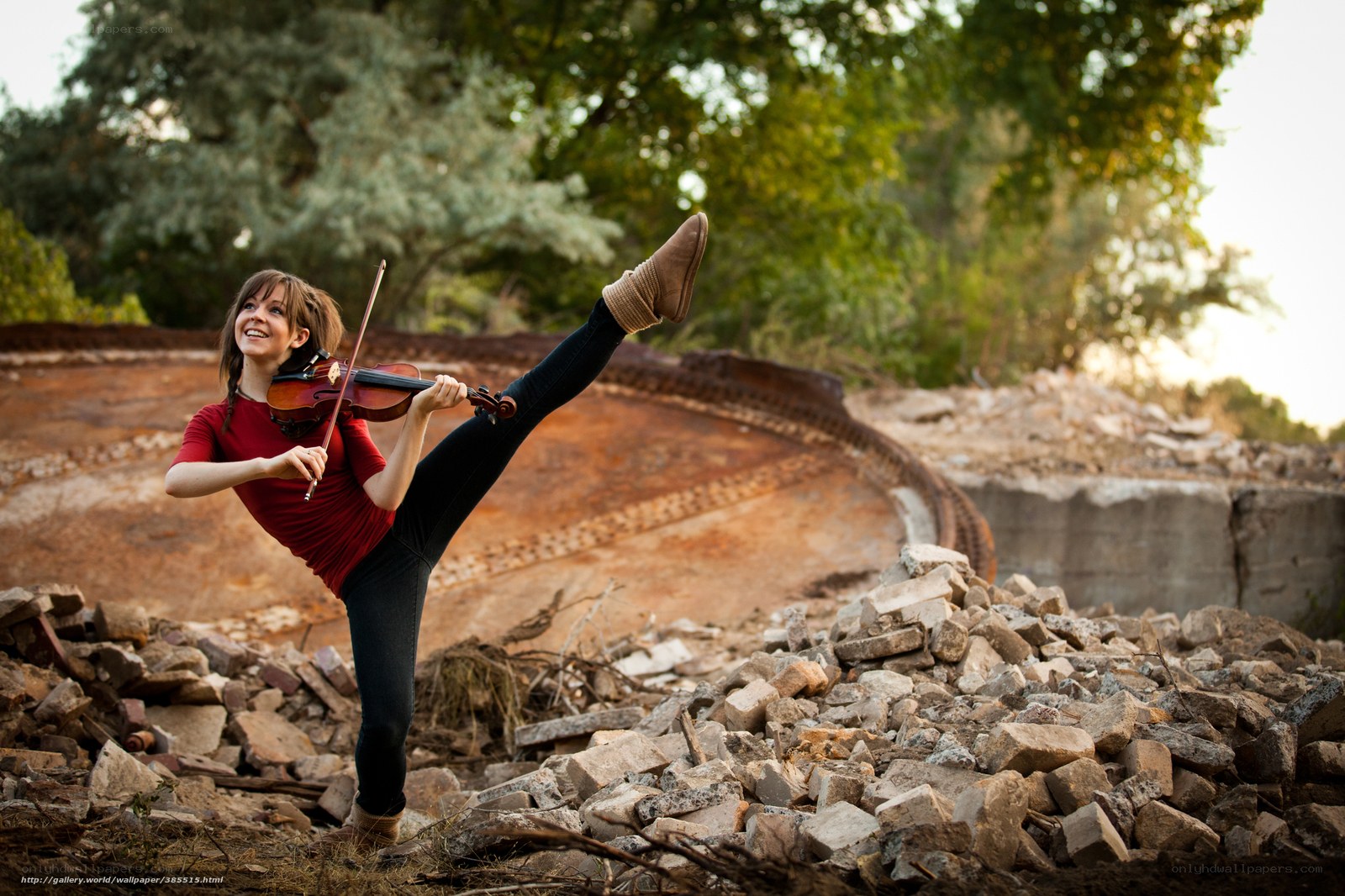 Woman playing violin in ruins