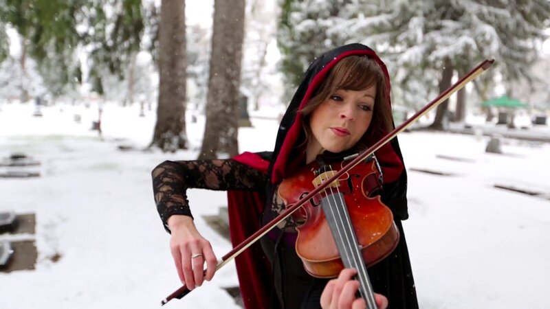 woman playing violin in snow