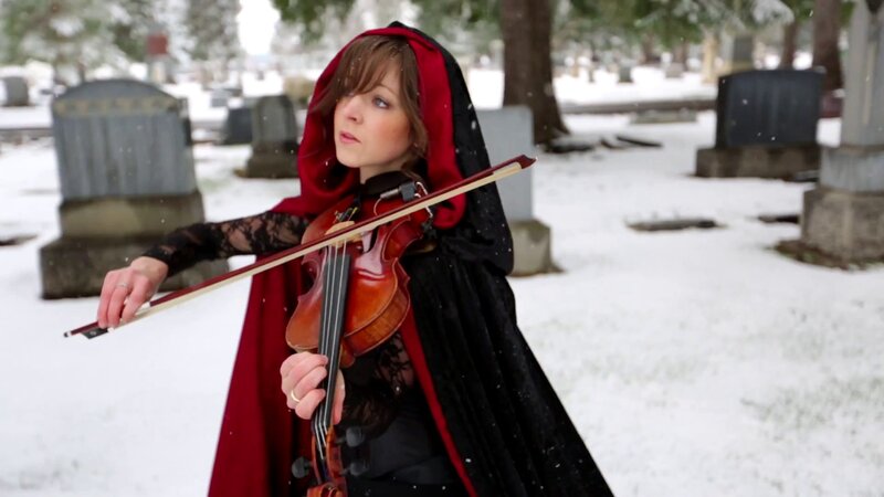 woman playing violin in snow