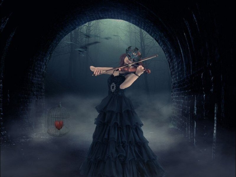 Woman playing violin in tunnel