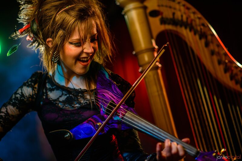Woman playing violin on stage