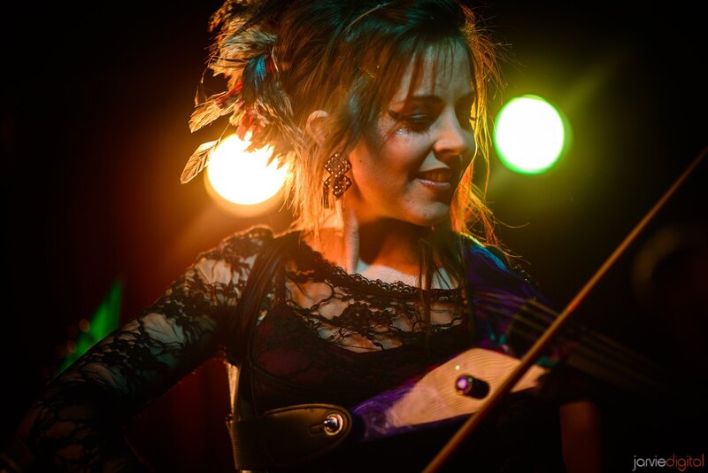woman playing violin on stage