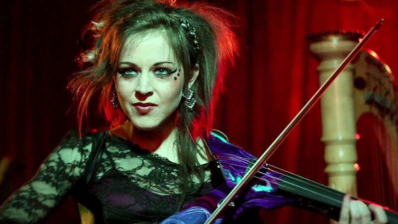 woman playing violin on stage