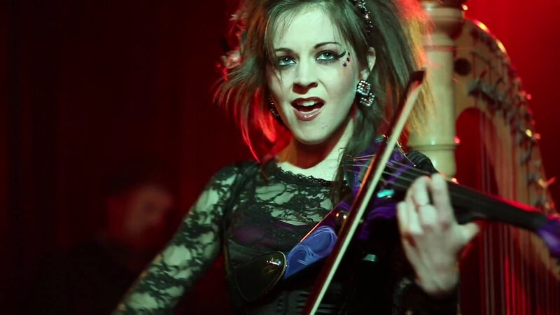 woman playing violin on stage