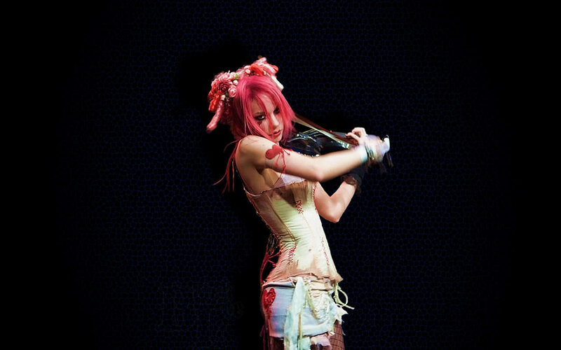 woman playing violin on stage