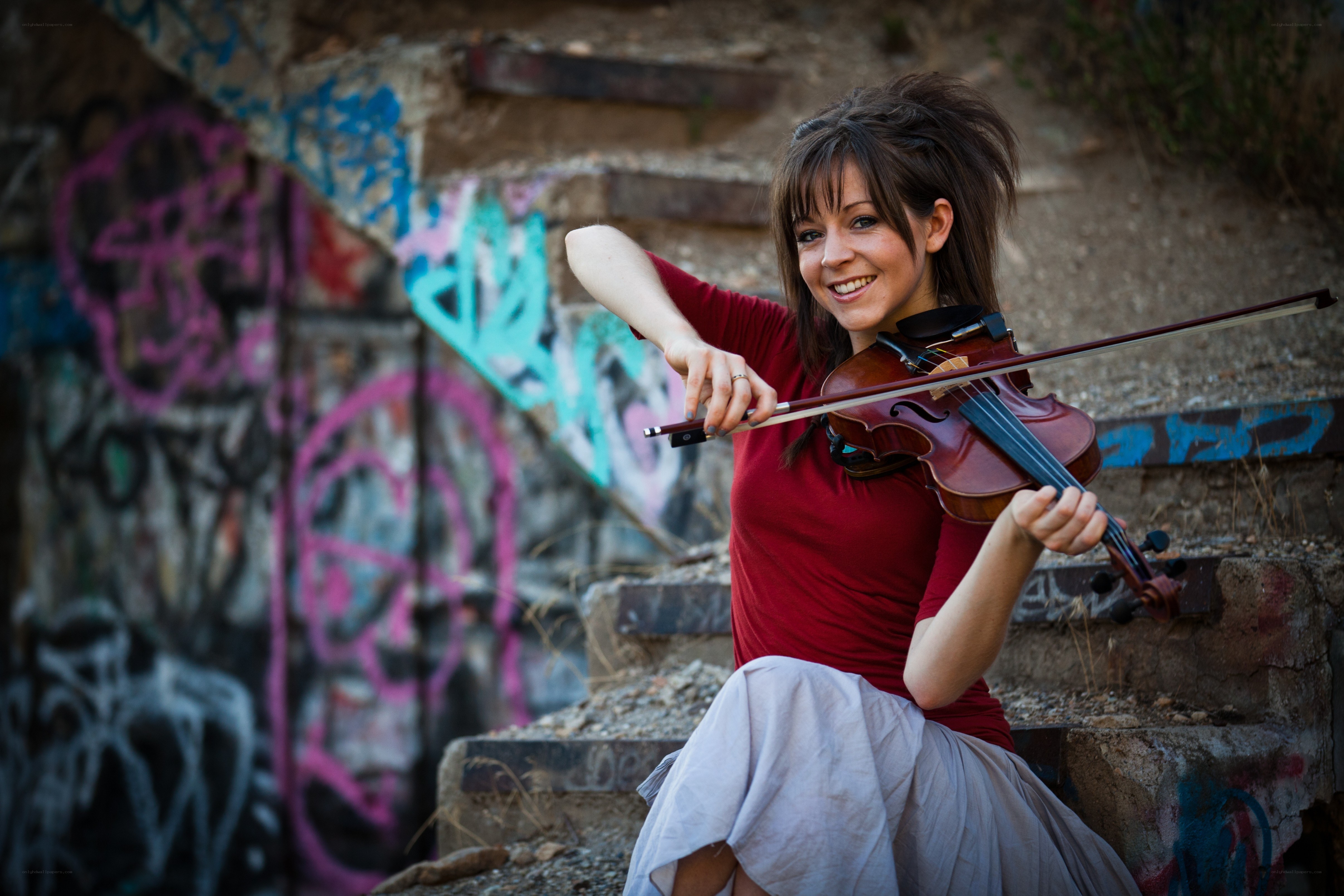 Woman playing violin on steps
