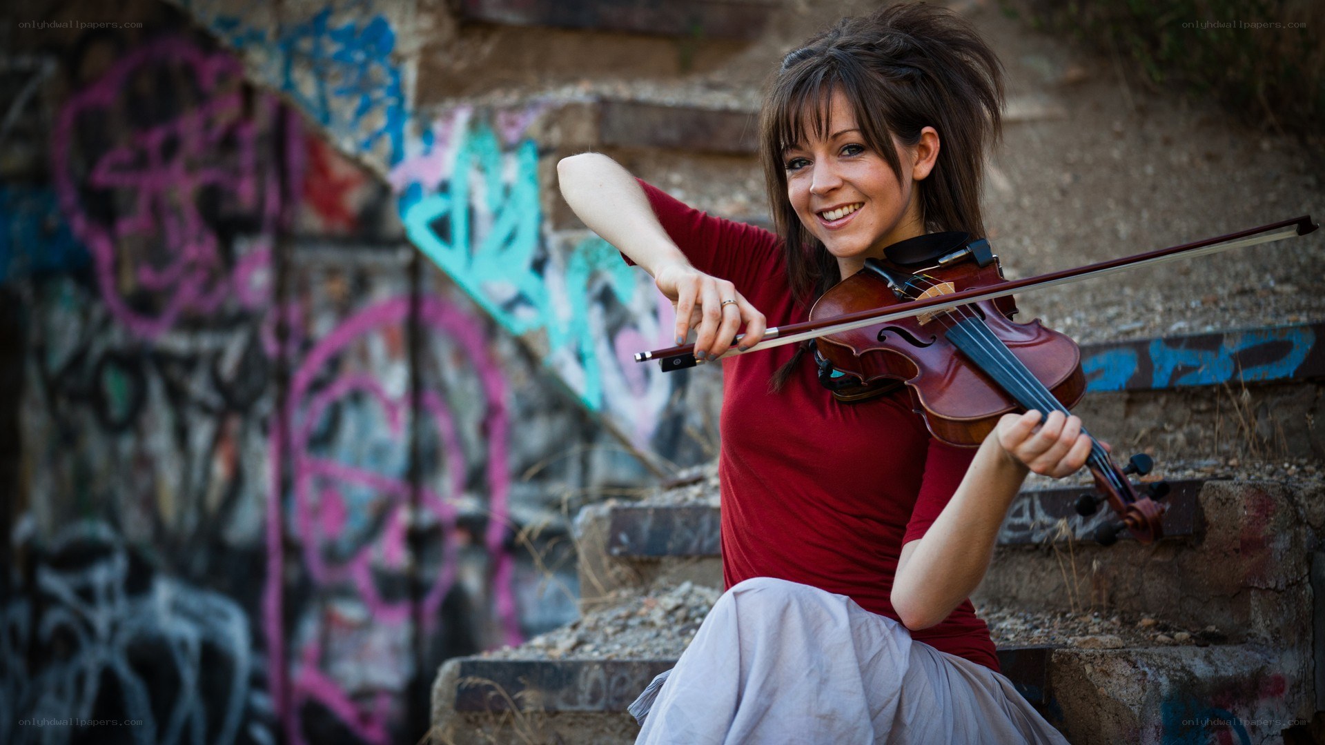 woman playing violin on steps