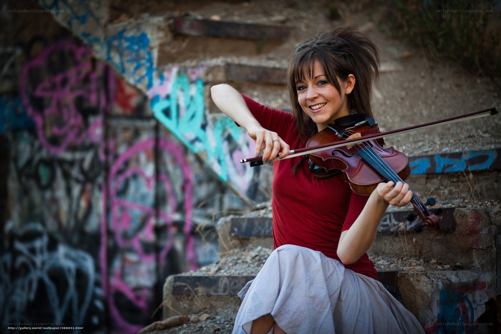 woman playing violin on steps