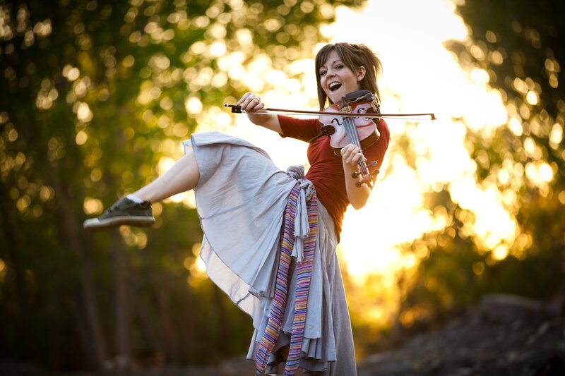 Woman playing violin outdoors