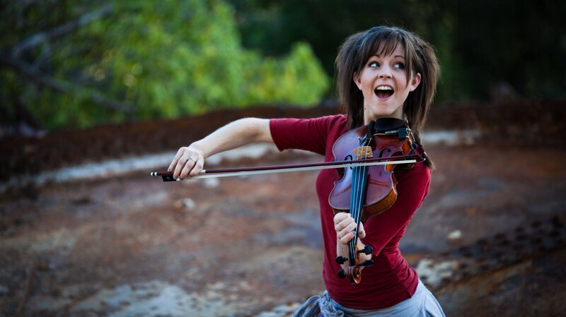 woman playing violin outdoors