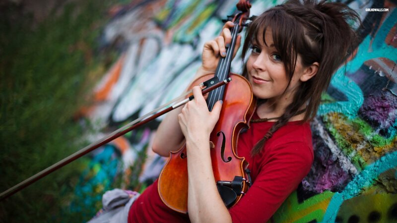 woman playing violin outdoors