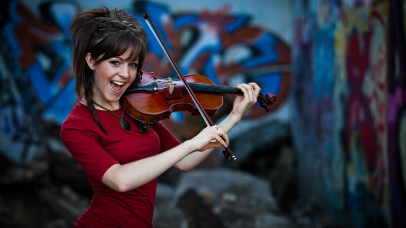 Woman playing violin outdoors