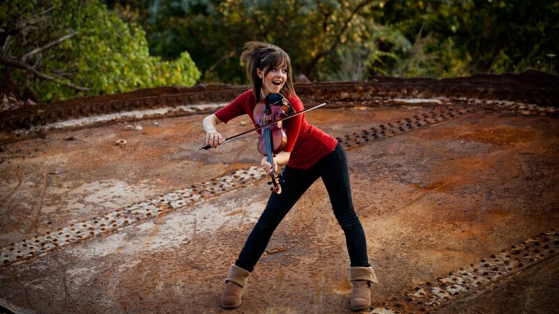 Woman playing violin outdoors