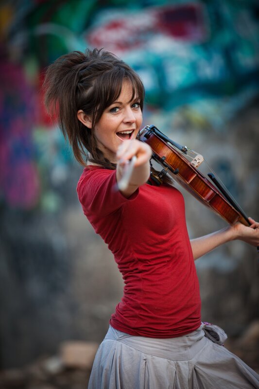 woman playing violin outdoors