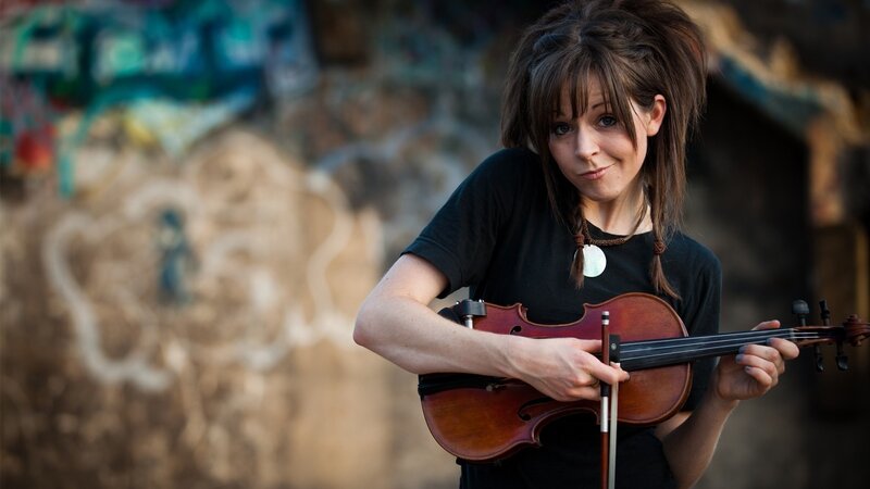 woman playing violin outdoors