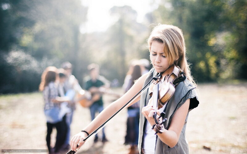 Woman playing violin outdoors