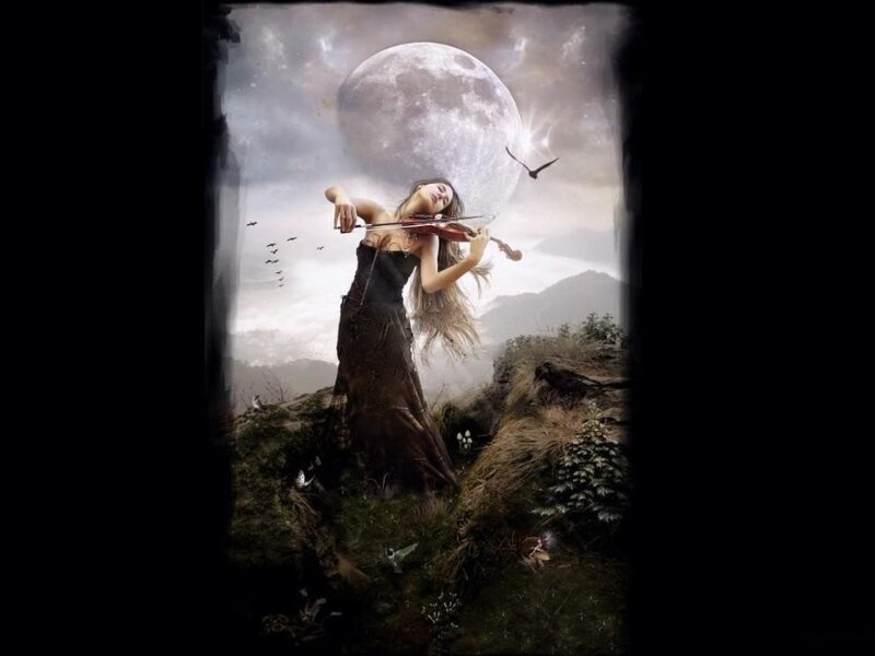 Woman playing violin under moon