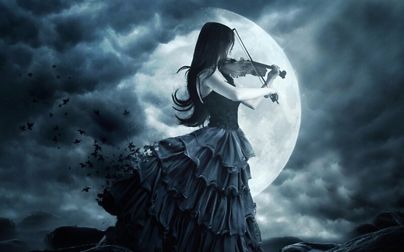 woman playing violin under moon