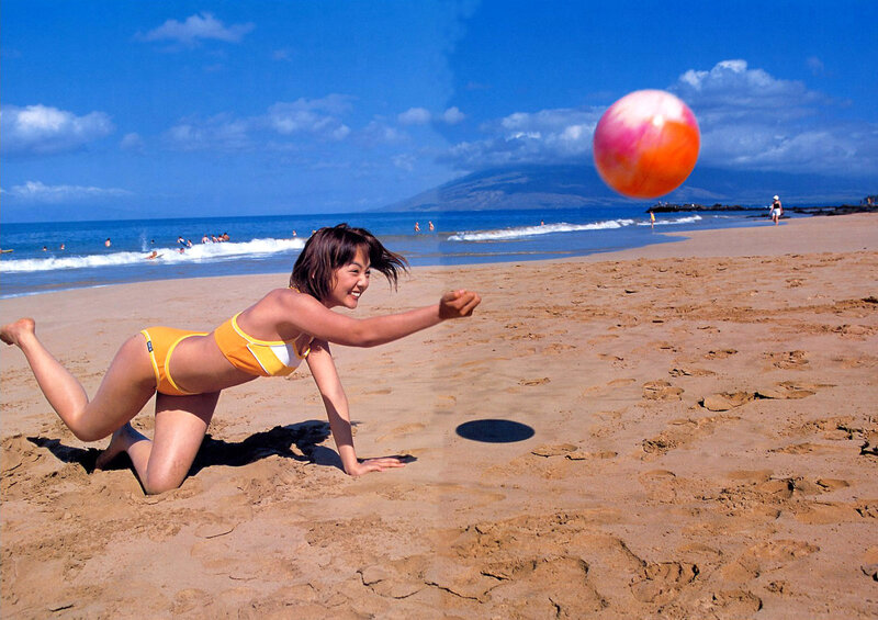 Woman playing with beach ball