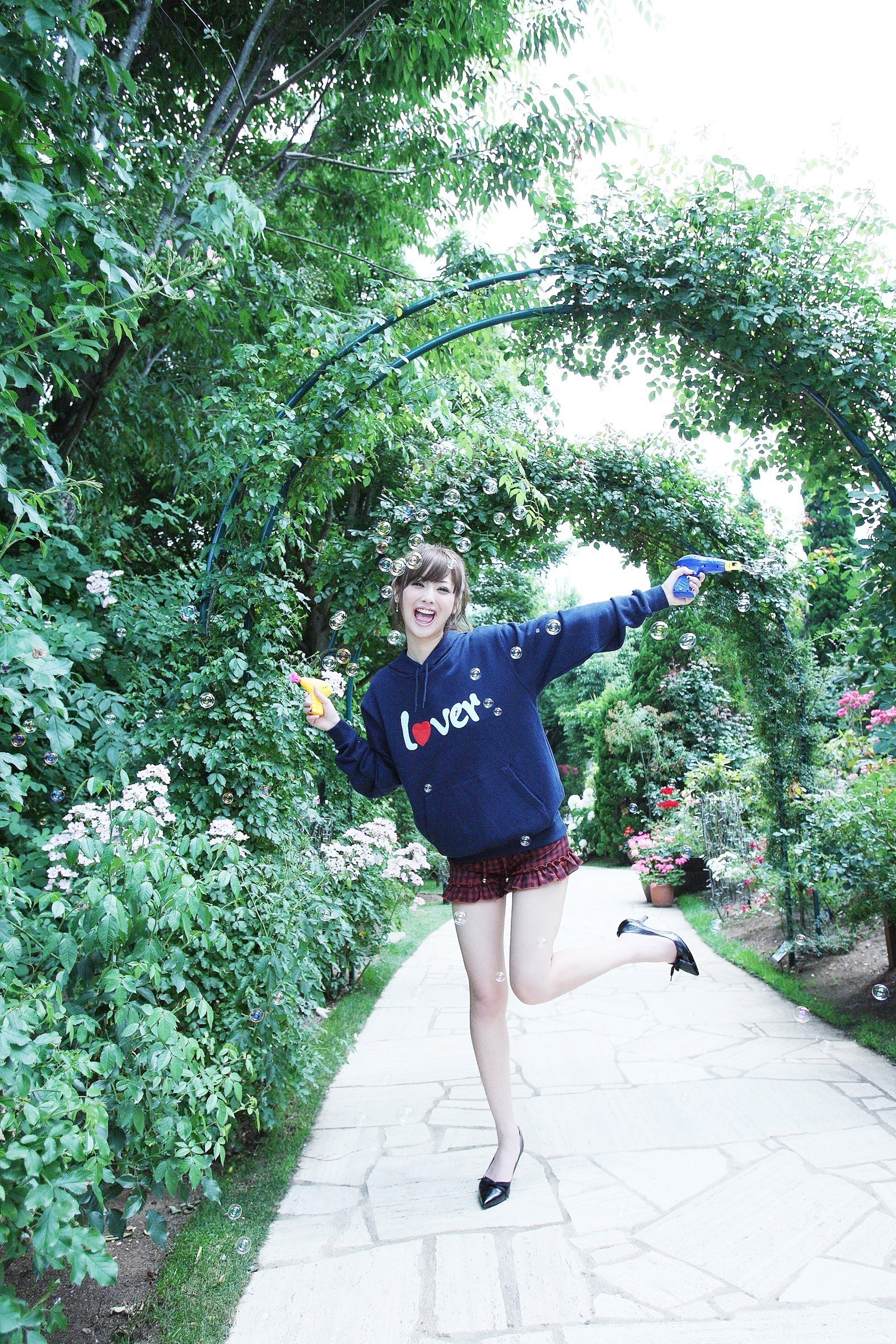 Woman playing with bubbles in garden