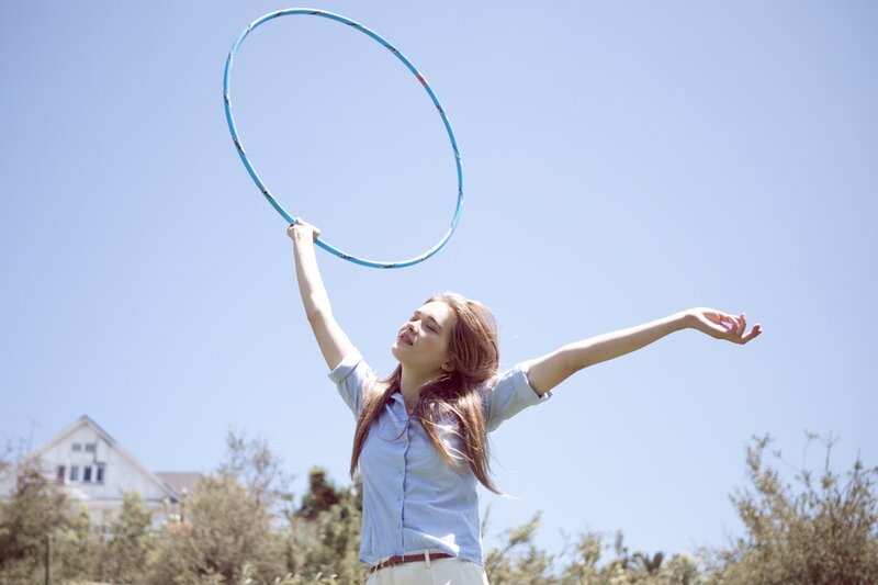 Woman playing with hula hoop