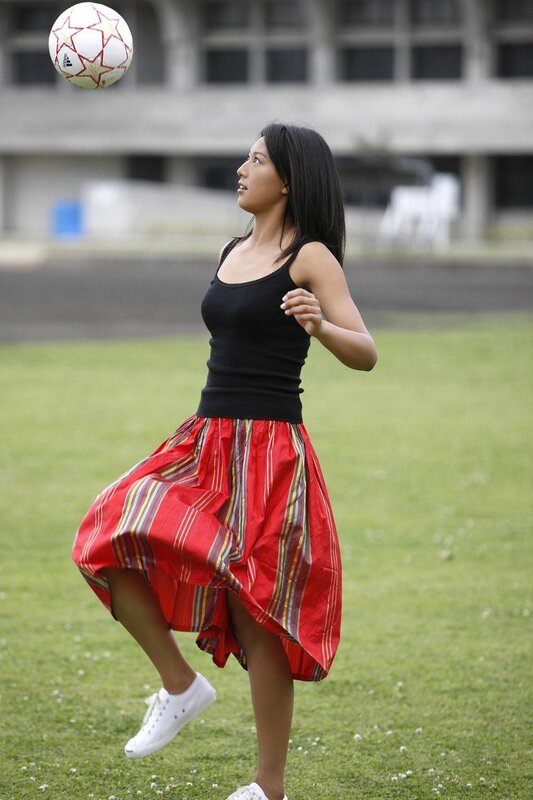 woman playing with soccer ball
