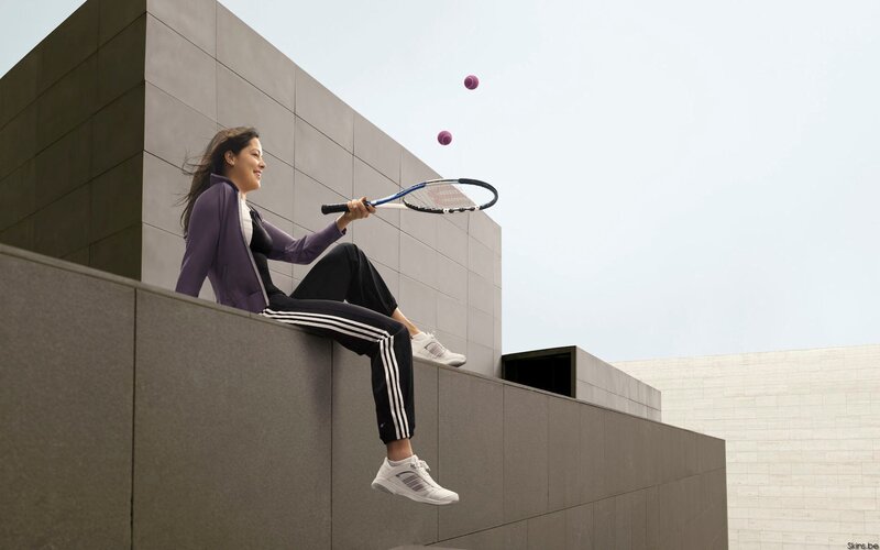 woman playing with tennis balls