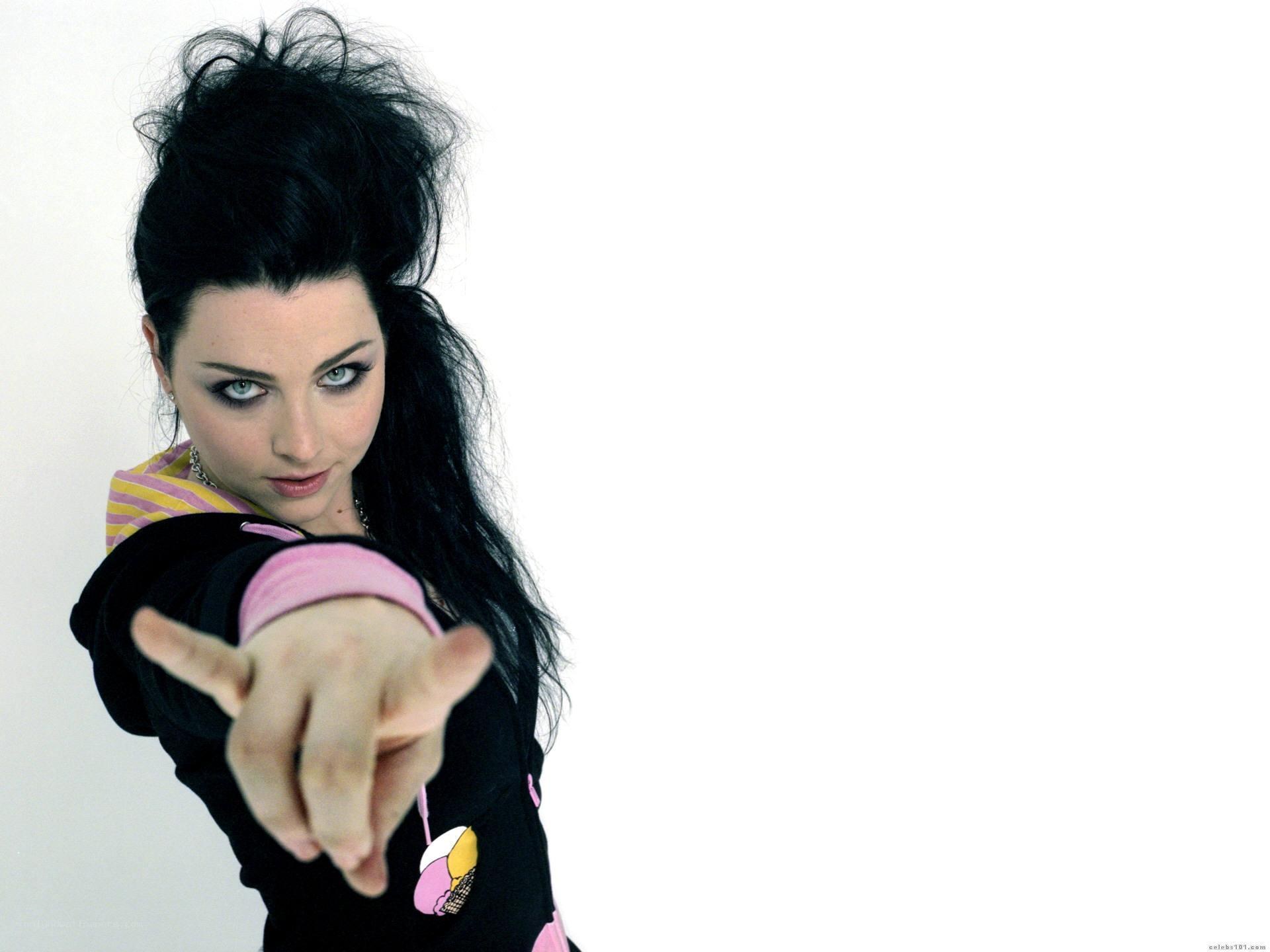 woman pointing at camera