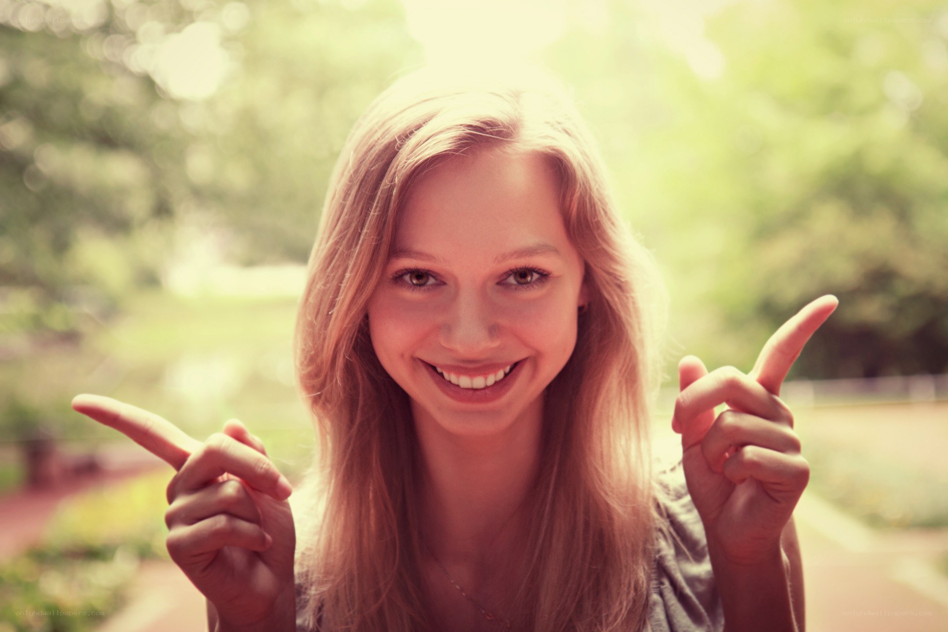 woman pointing at camera