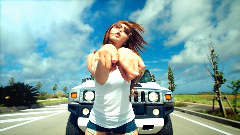 Woman Pointing at Camera — Blue, Energetic, Afternoon