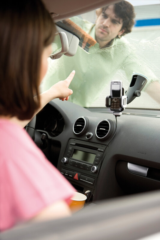 woman pointing at man through car window