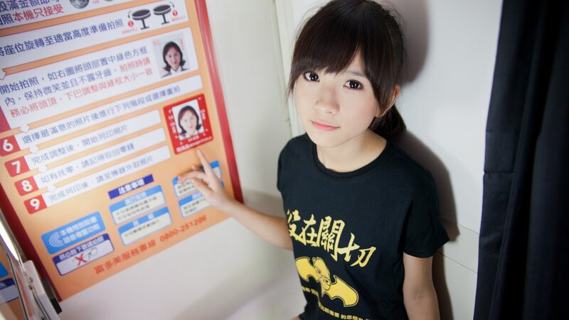 woman pointing at photo instructions