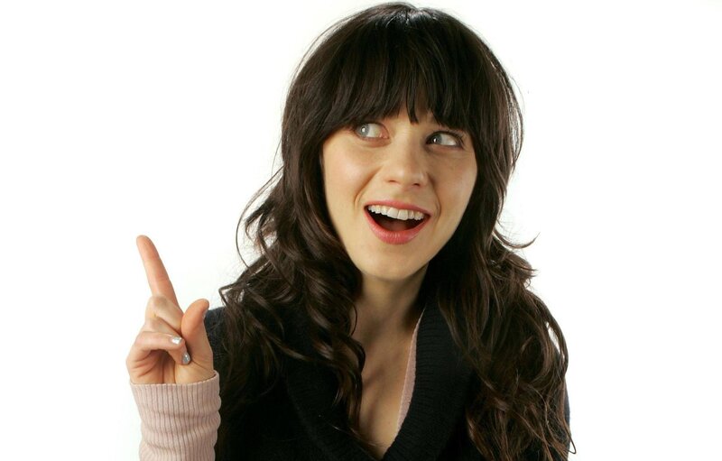 woman pointing up with smile