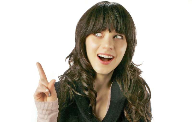 woman pointing up with smile