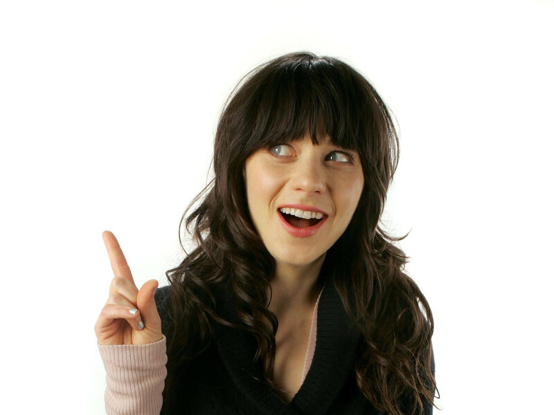 woman pointing up with smile
