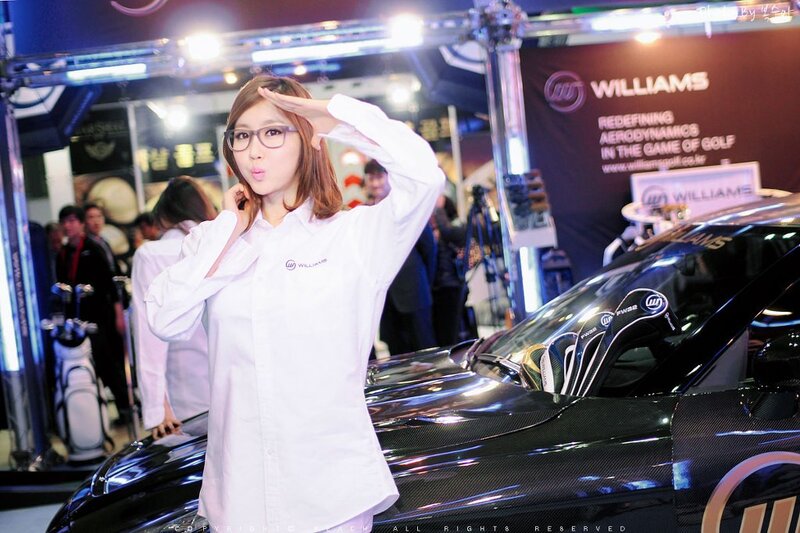 Woman posing at a golf event