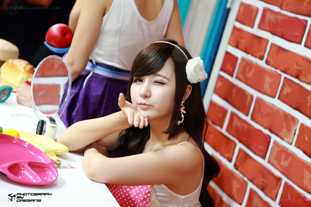 woman posing at a table