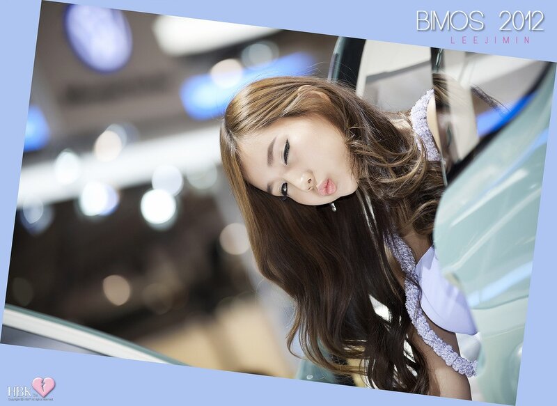 Woman posing at auto show