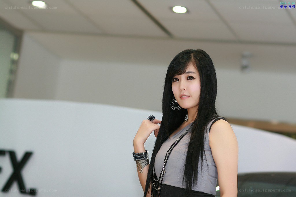 woman posing at auto show