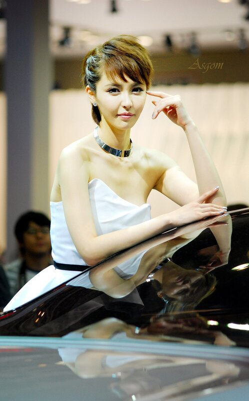 woman posing at auto show