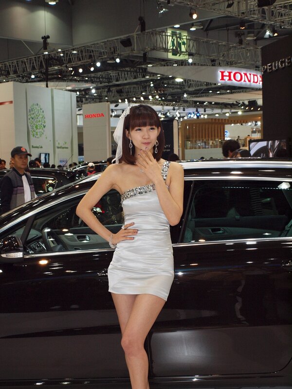 Woman posing at auto show