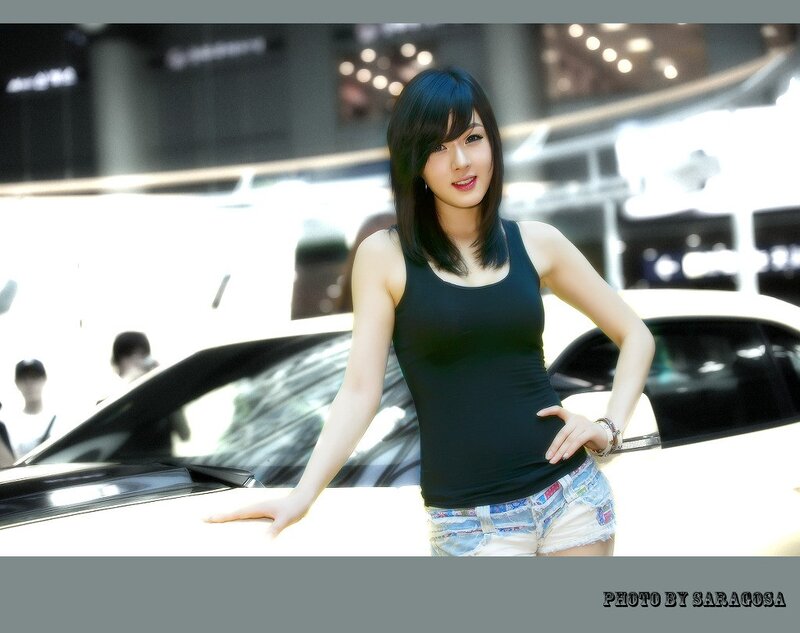 woman posing at car show