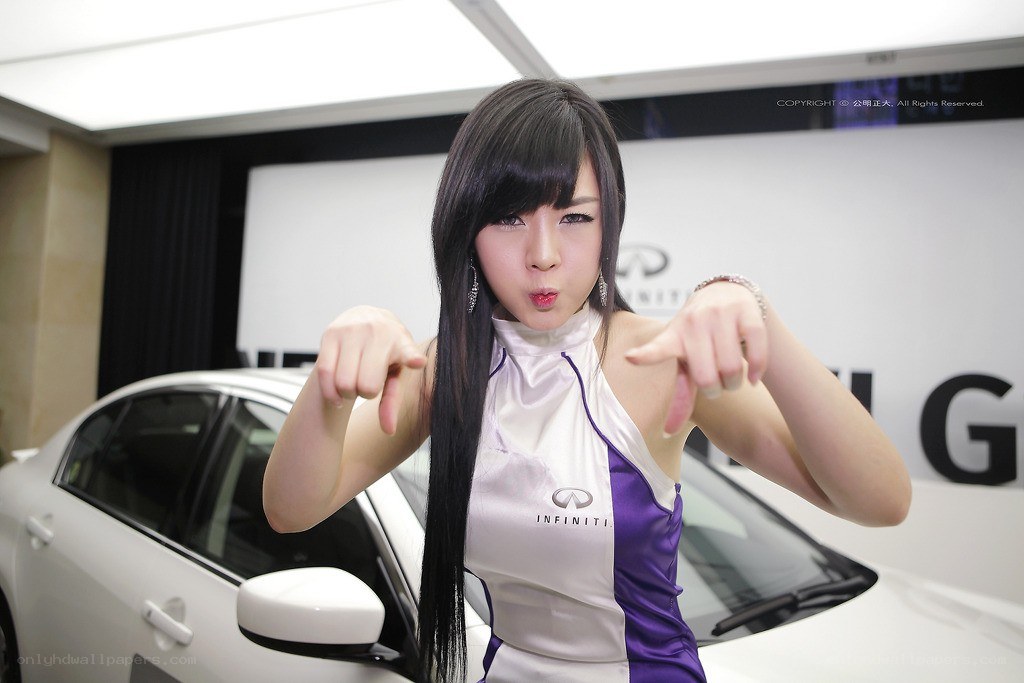 woman posing at car show