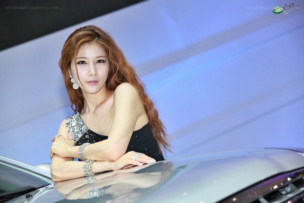 woman posing at car show